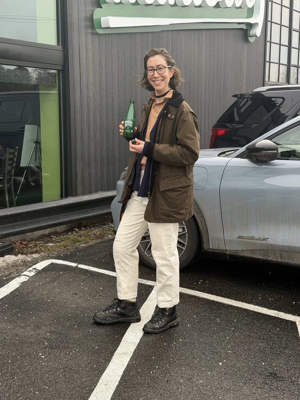 Becca outside with a bottle of wine